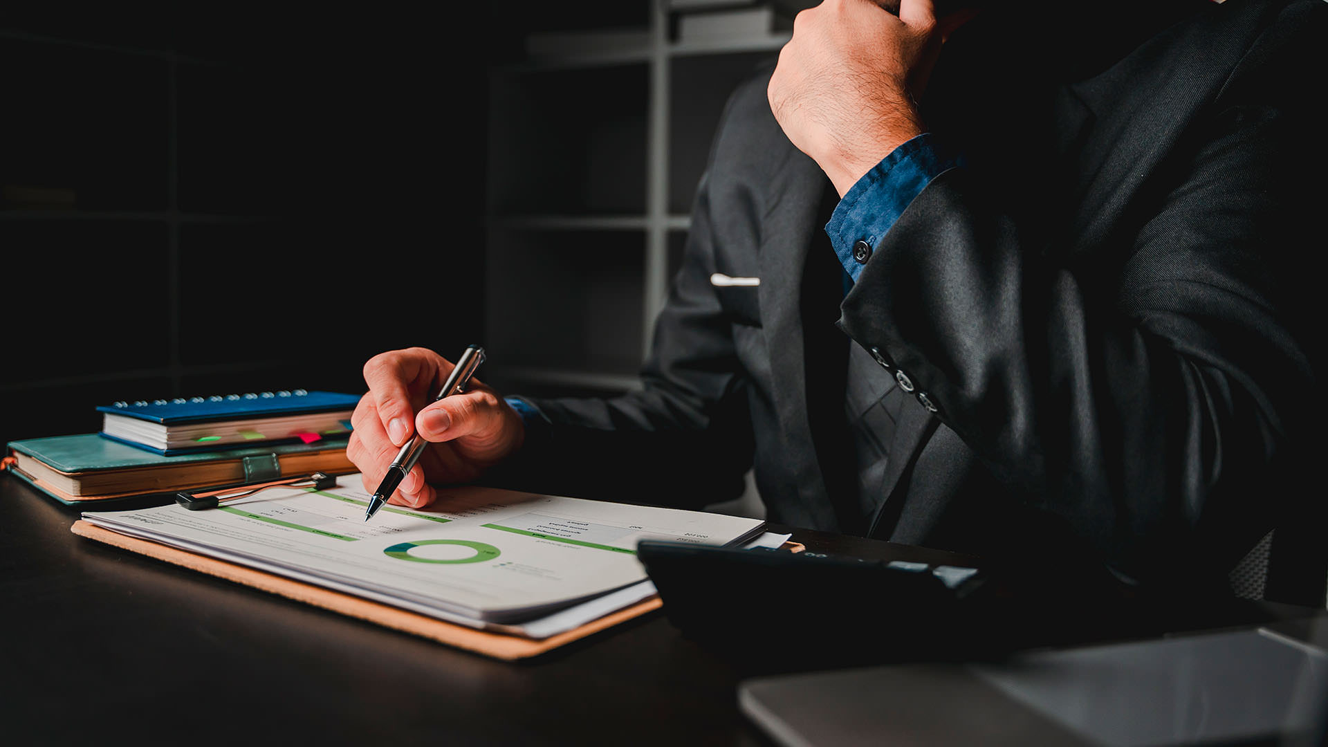 Businessman at desk | at Delta Settlements