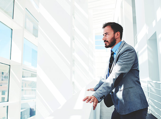 Man over looking balcony | at Delta Settlements